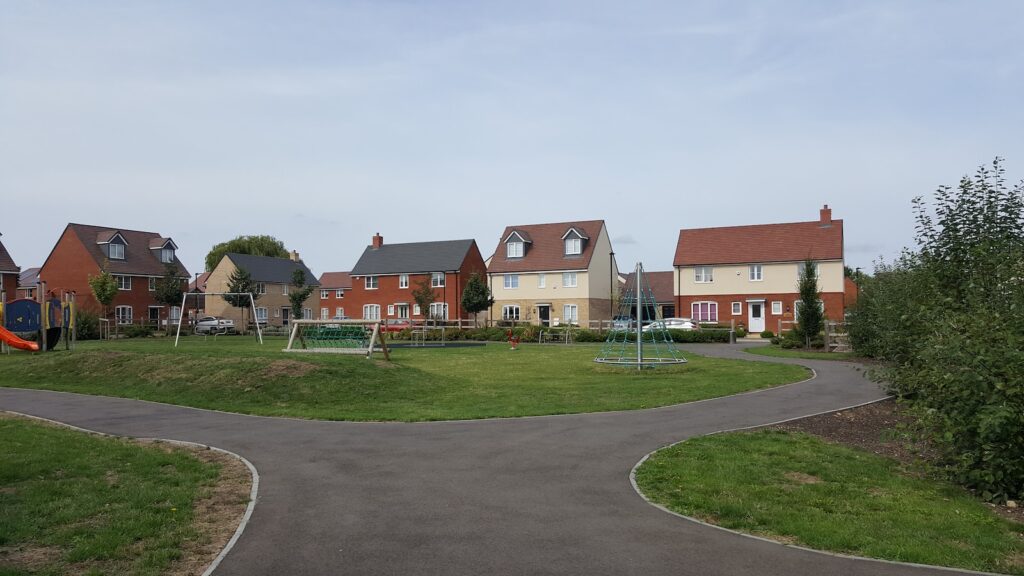 houses near play yard during daytime